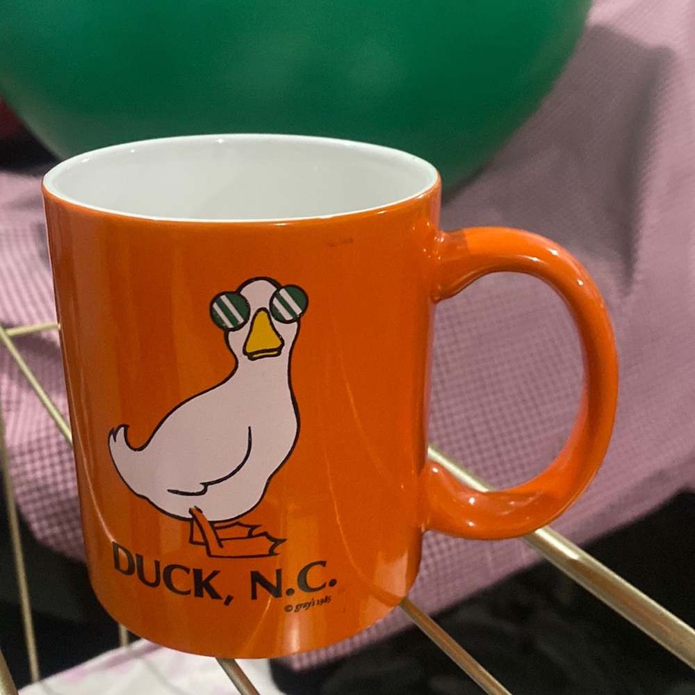 Orange  coffee mug -Duck ,NC  gray’s 1985